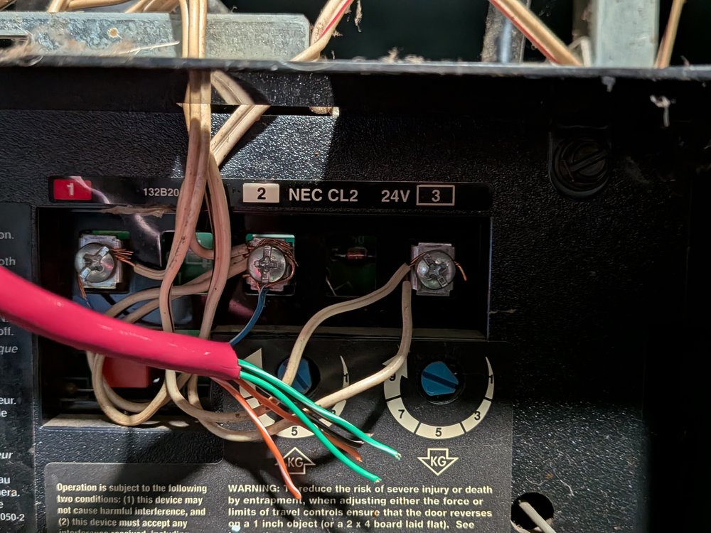 Garage door opener terminal block with numbered dry-contact screw terminals